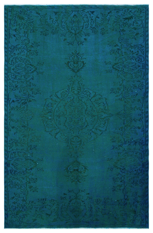 Load image 1 in gallery view. Monochromatic teal rug with a traditional distressed floral medallion pattern on a white background.