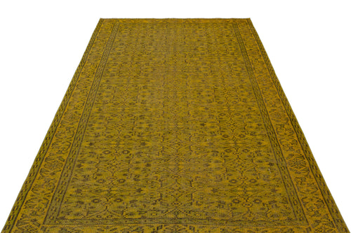 Load image 1 in gallery view. Mustard yellow rug with a dark brown traditional floral medallion pattern and a detailed border on a white background.