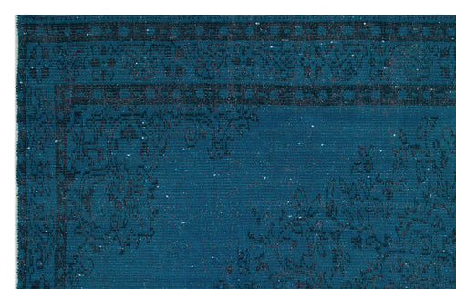 Load image 1 in gallery view. Teal rug with a dark, distressed traditional floral medallion pattern and a geometric border.