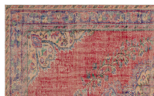 Load image 1 in gallery view. Distressed red, beige, and blue traditional rug with a faded floral medallion border and intricate woven texture.