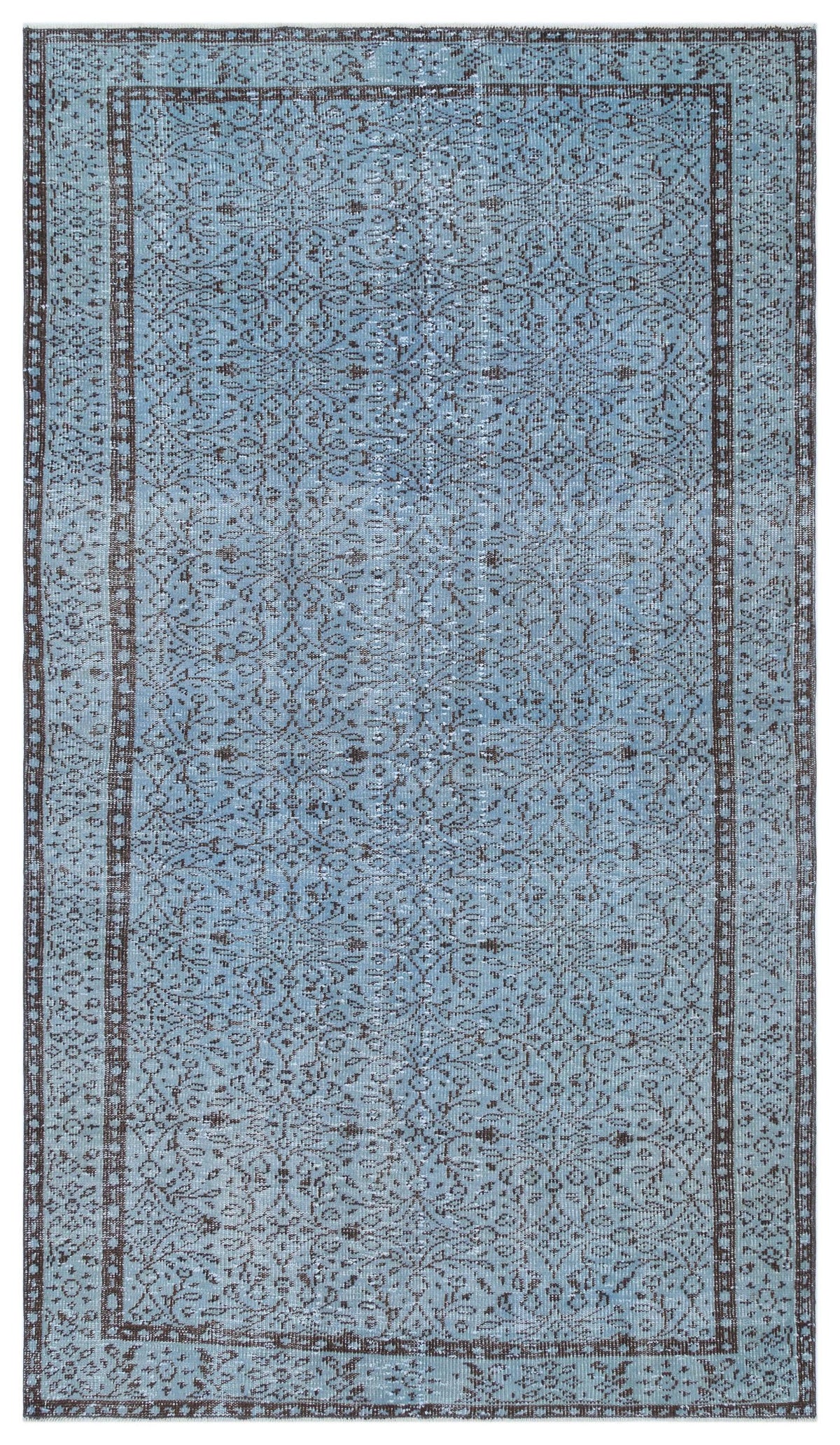 Light blue and dark brown distressed rug with an intricate floral medallion pattern and a bordered edge.