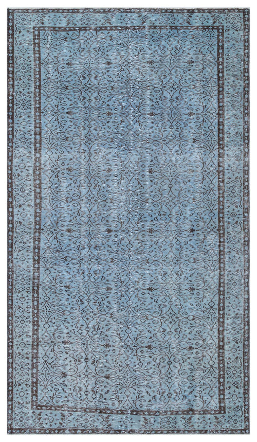 Load image 1 in gallery view. Light blue and dark brown distressed rug with an intricate floral medallion pattern and a bordered edge.