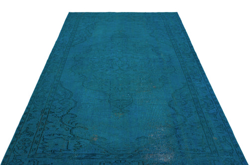 Load image 1 in gallery view. Monochromatic teal vintage-style rug with a faint, distressed traditional medallion pattern on a white background.
