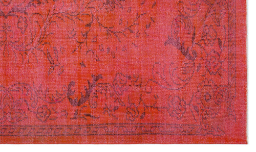 Load image 1 in gallery view. Vibrant red rug with a distressed, dark charcoal floral medallion pattern and a detailed border.