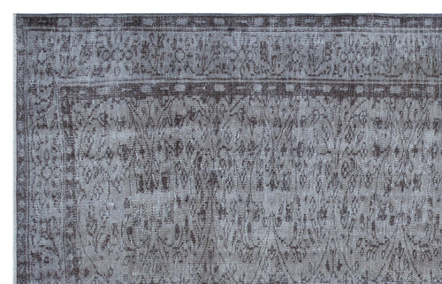 Load image 1 in gallery view. Grey and charcoal distressed rug with a traditional floral medallion pattern and a decorative border.