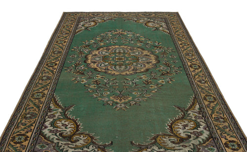 Load image 1 in gallery view. Emerald green traditional rug with a central floral medallion and ornate border, isolated on a white background.