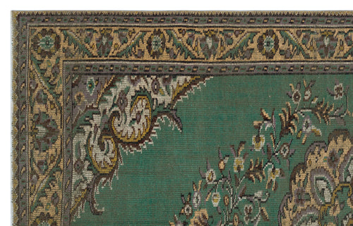 Load image 1 in gallery view. Emerald green traditional rug with a decorative border and intricate floral medallion pattern in gold, grey, and brown.