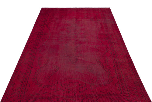Load image 1 in gallery view. Deep red vintage-style rug with a faded, dark floral medallion pattern and a decorative border on a white background.