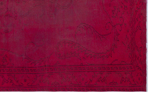 Load image 1 in gallery view. Deep red overdyed vintage rug with a subtle, dark-toned traditional floral medallion pattern and a geometric border.