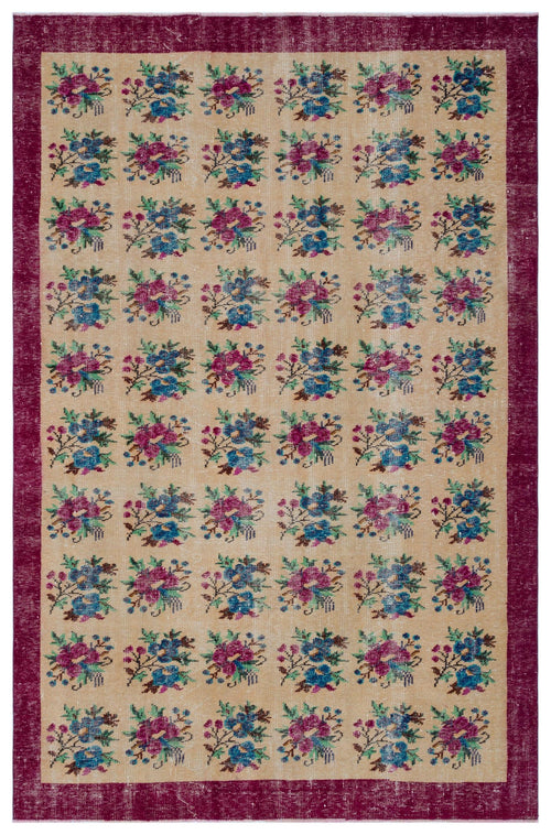 Load image 1 in gallery view. Beige rug with a repeating floral pattern in magenta and blue, framed by a wide, distressed magenta border.