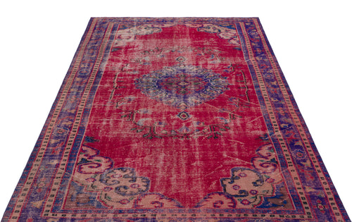 Load image 1 in gallery view. Distressed magenta and blue vintage-style rug with a central medallion and ornate border pattern on a white background.