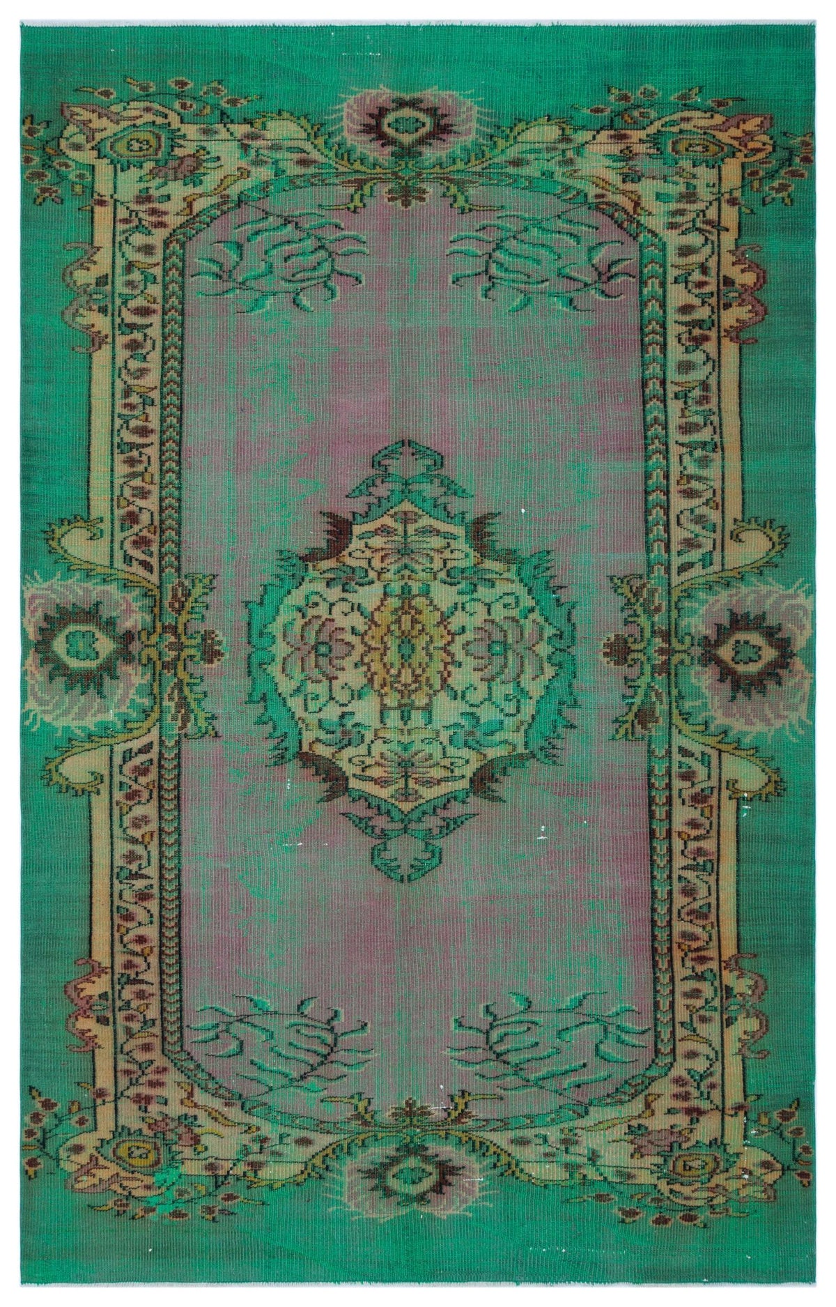 Emerald green and mauve vintage-style rug with a central floral medallion and ornate decorative border.