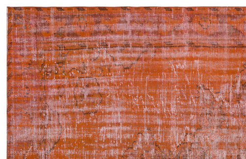 Load image 1 in gallery view. Burnt orange and faded pink distressed rug with a faint, traditional medallion pattern.