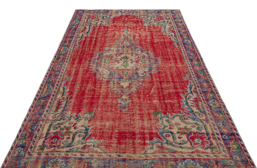 Load image 1 in gallery view. Distressed red traditional rug with a central medallion and blue and beige floral border patterns on a white background.