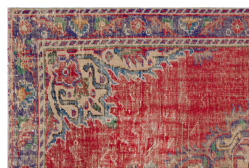 Load image 1 in gallery view. Distressed red, blue, and beige traditional rug with a floral medallion border and worn texture.