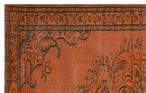 Load image 1 in gallery view. Burnt orange rug with a distressed traditional floral border and central medallion pattern in olive green and black.