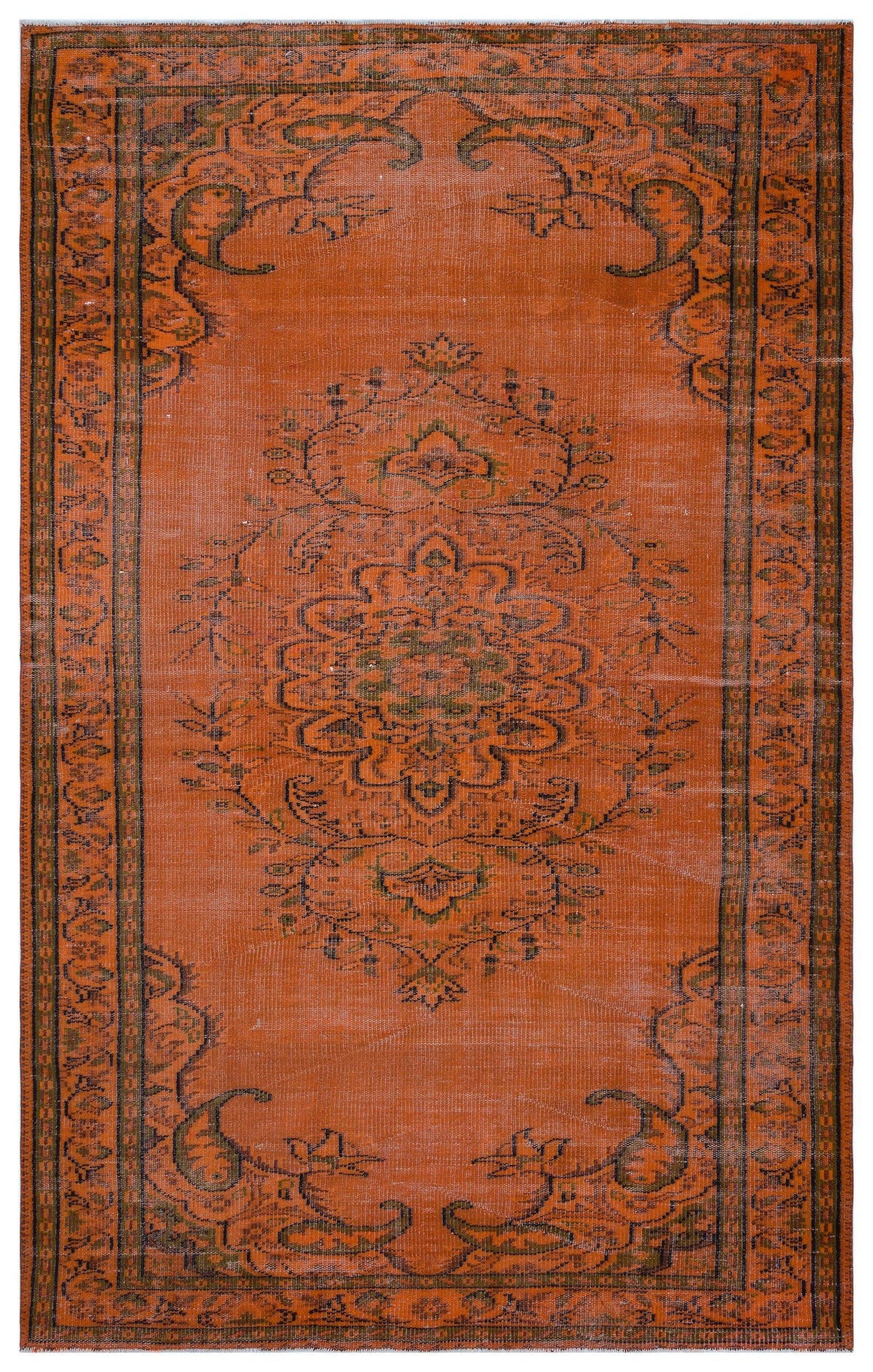 Burnt orange vintage-style rug with a dark green central floral medallion and a decorative border.