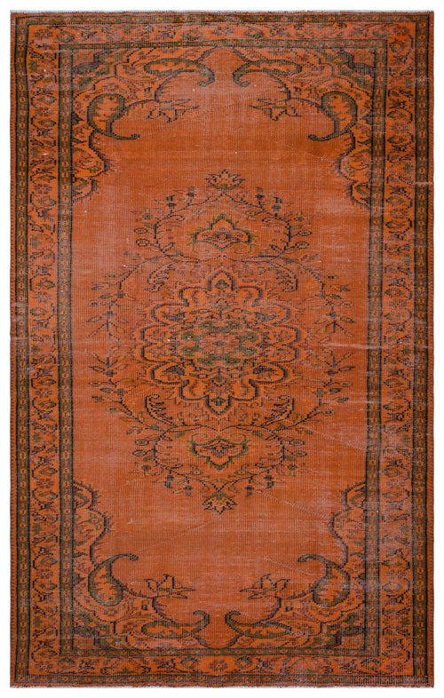 Load image 1 in gallery view. Burnt orange vintage-style rug with a dark green central floral medallion and a decorative border.
