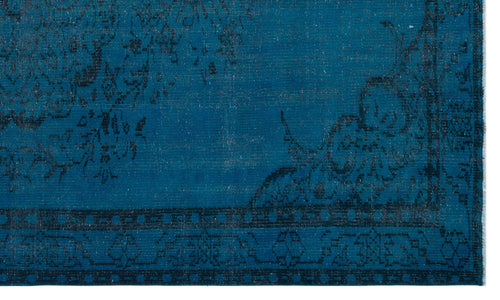 Load image 1 in gallery view. Deep teal rug with a black distressed floral medallion pattern and a geometric border.