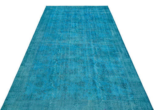Load image 1 in gallery view. Bright turquoise vintage-style rug with a faded, distressed traditional medallion pattern on a white background.