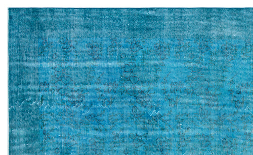 Load image 1 in gallery view. Teal distressed rug with a faint, dark blue traditional floral pattern.