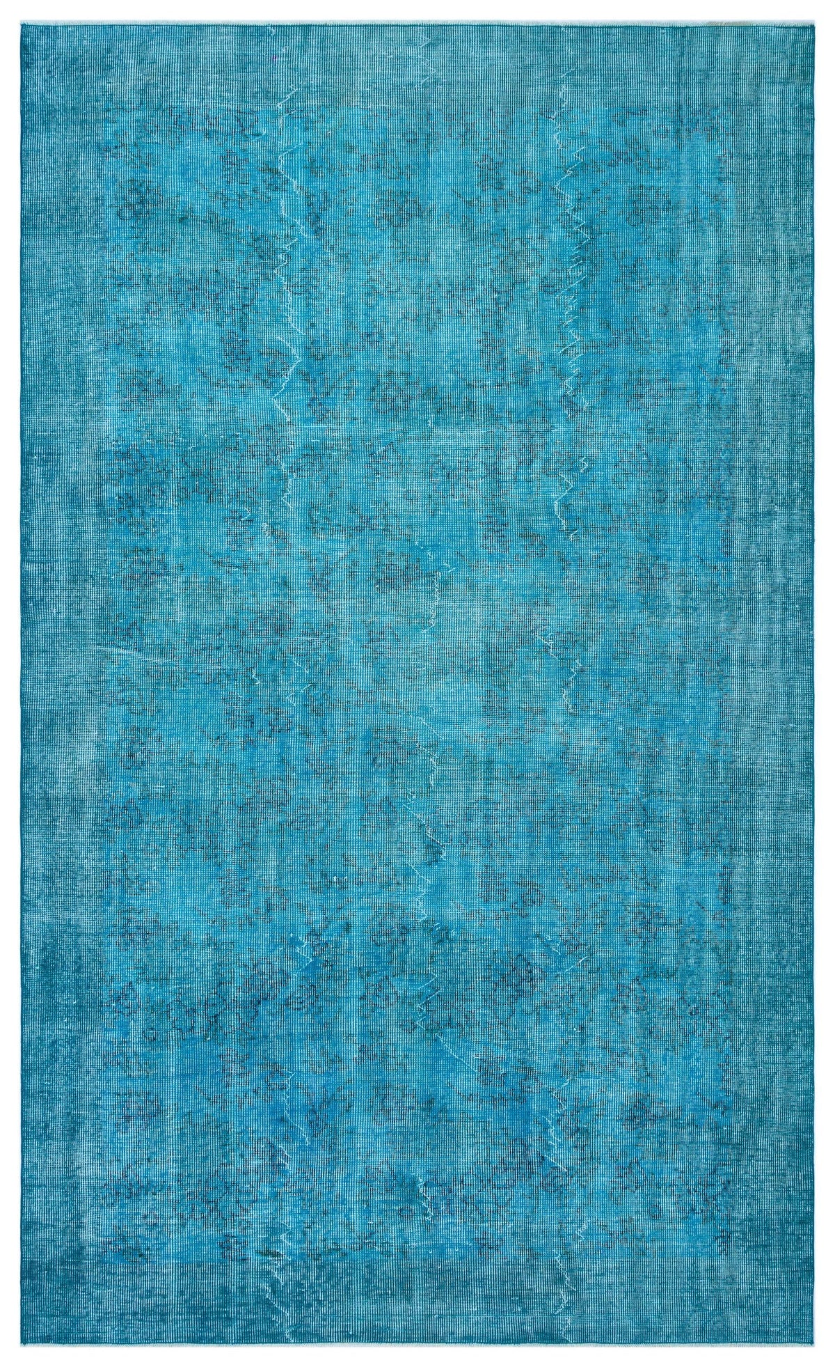 Solid turquoise rug with a distressed, faded texture and subtle vertical linear patterns.
