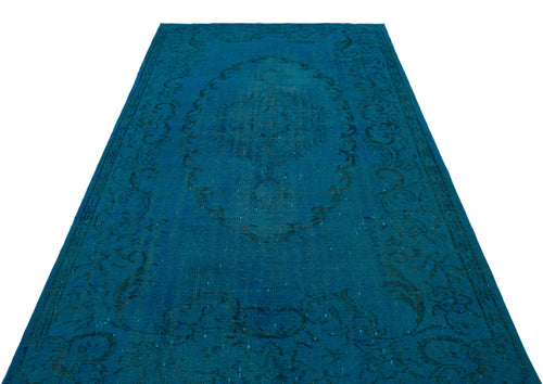 Load image 1 in gallery view. Monochromatic teal rug with a distressed traditional medallion and floral border pattern on a white background.