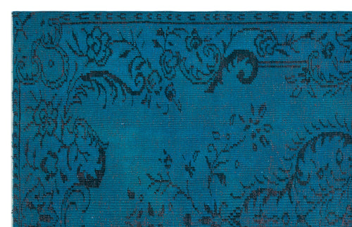 Load image 1 in gallery view. Teal rug with a black distressed floral pattern and a decorative border.