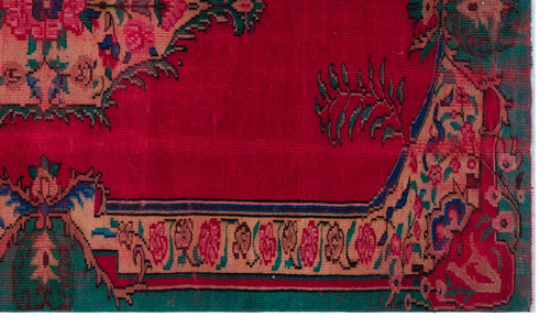 Load image 1 in gallery view. Red traditional rug with a floral border and central medallion detail in pink, green, and blue on a white background.