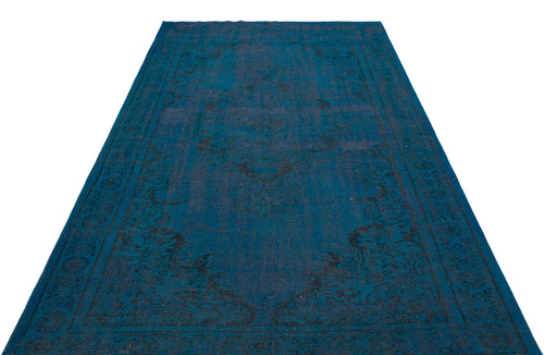 Load image 1 in gallery view. Deep blue rectangular rug with a dark, distressed traditional medallion pattern on a white background.