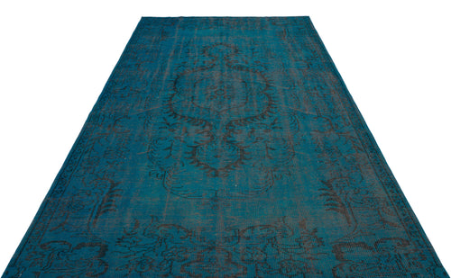 Load image 1 in gallery view. Teal and charcoal distressed rug with a traditional central medallion pattern on a white background.