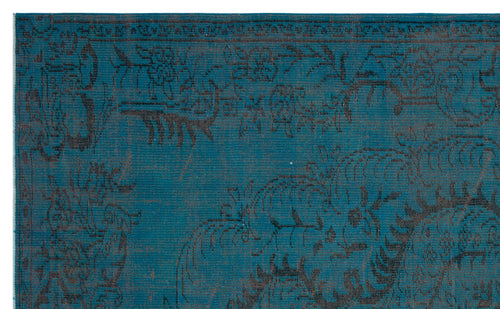 Load image 1 in gallery view. Teal rug with a dark charcoal floral and vine pattern and a decorative border.