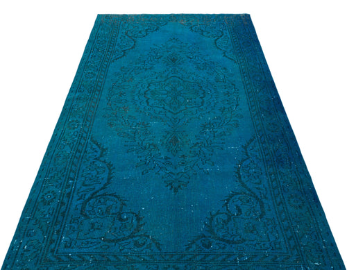 Load image 1 in gallery view. Teal distressed area rug with a dark blue traditional floral medallion pattern and ornate border.