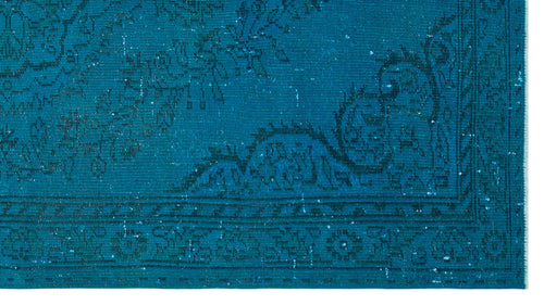 Load image 1 in gallery view. Teal distressed rug with a dark blue traditional floral medallion pattern and a decorative border.