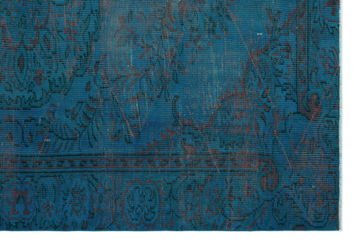 Load image 1 in gallery view. Teal and dark brown distressed rug with a traditional floral medallion pattern and a detailed border.