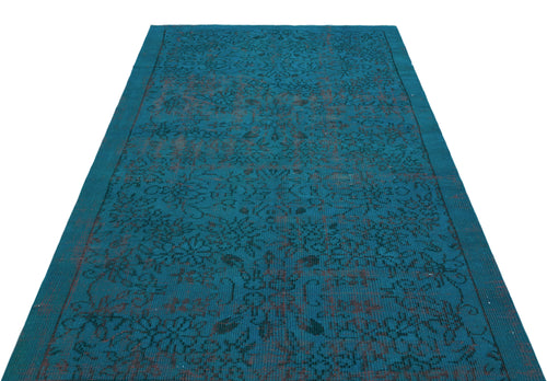 Load image 1 in gallery view. Teal rectangular rug with a dark, distressed floral medallion pattern on a white background.