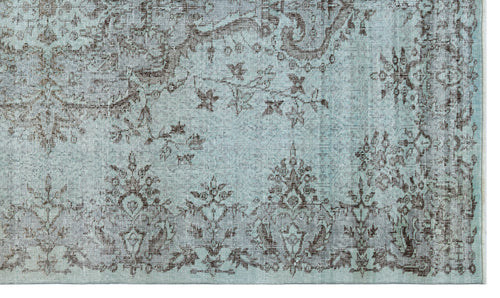 Load image 1 in gallery view. Light blue rug with a distressed dark brown traditional floral and medallion pattern.