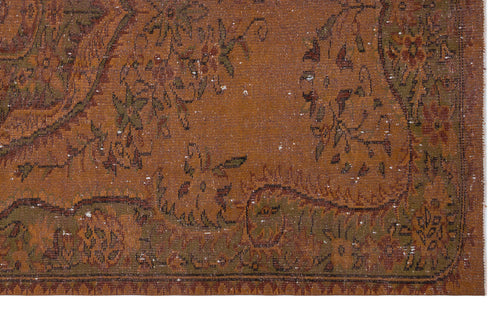 Load image 1 in gallery view. Distressed rust-orange rug with a faded olive green and brown floral paisley pattern.