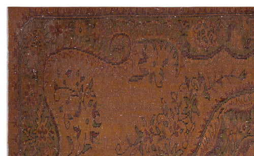 Load image 1 in gallery view. Rust-colored vintage rug with a distressed floral medallion pattern and dark brown border details.