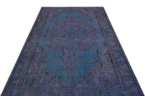 Load image 1 in gallery view. Distressed teal and purple vintage-style rug with a central medallion and ornate floral border.