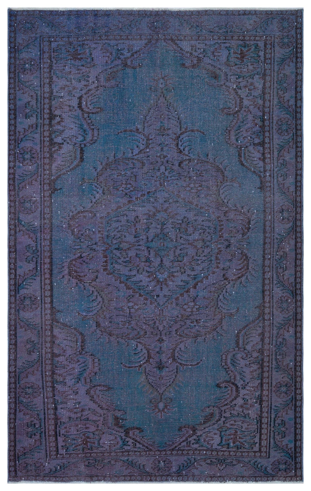 Deep blue and purple distressed traditional rug with a central floral medallion and ornate border.