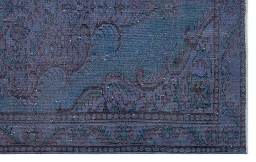 Load image 1 in gallery view. Deep blue and purple distressed rug with a traditional floral border and faded medallion pattern.