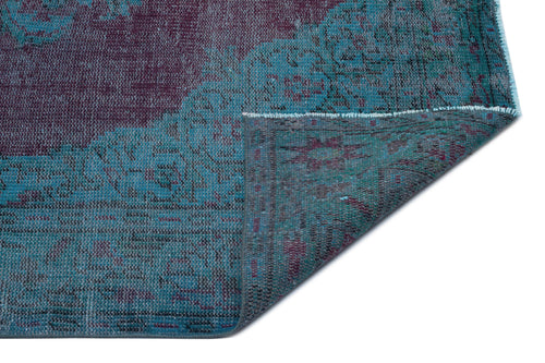 Load image 1 in gallery view. Distressed teal and plum vintage-style rug with a folded corner revealing the underside texture on a white background.