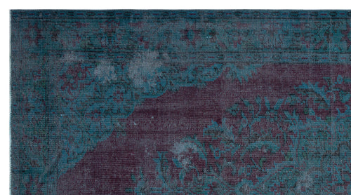 Load image 1 in gallery view. Distressed teal and deep purple rug with a faded traditional floral medallion pattern.