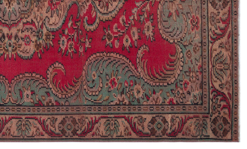 Load image 1 in gallery view. Red rug with intricate sage green and beige floral paisley patterns and a decorative geometric border.