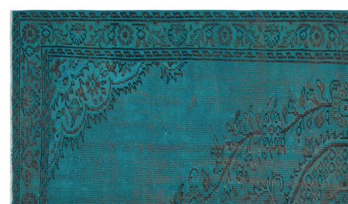 Load image 1 in gallery view. Teal and black distressed rug with a traditional floral medallion border and geometric corner detail.
