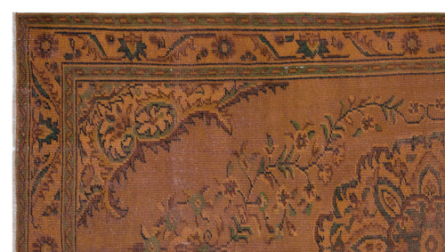 Load image 1 in gallery view. Rust-colored traditional rug with a dark green and brown floral border and central medallion pattern.