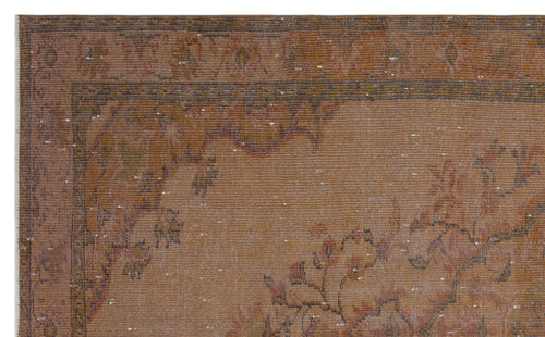 Load image 1 in gallery view. Distressed terracotta and brown vintage-style rug with a faded floral border and central medallion pattern.