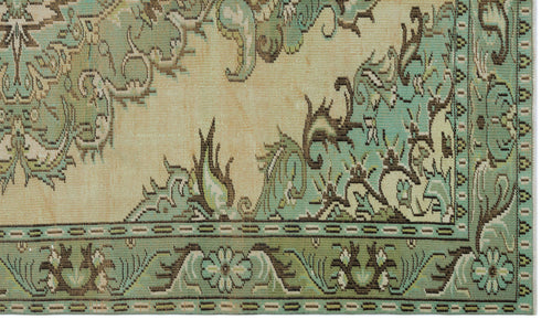 Load image 1 in gallery view. Sage green and beige rug with a traditional floral medallion pattern and a detailed geometric border.