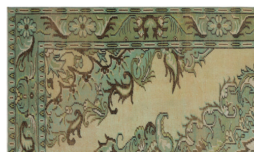 Load image 1 in gallery view. Sage green and beige rug with a traditional floral border and intricate vine-like patterns.